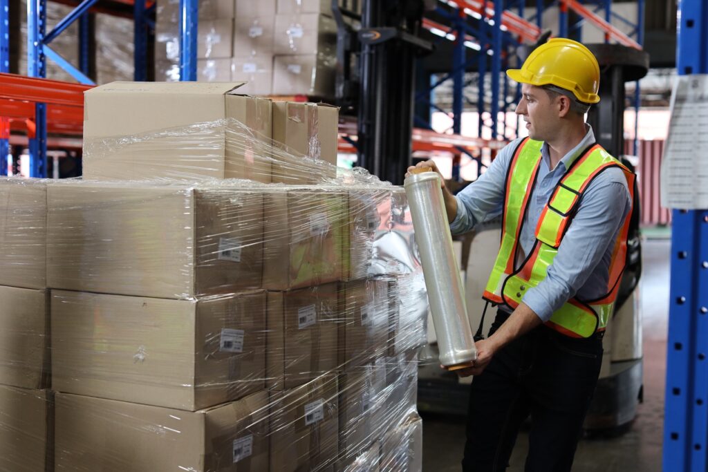 Wrapping pallets with stretch film in the warehouse to protect products